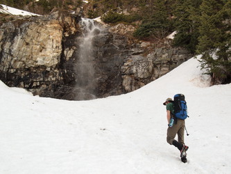Walking below the waterfall that the summer trail to Snoqualmie Mtn crosses above.