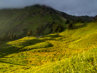 White Pass and White Mountain with its head in the clouds.